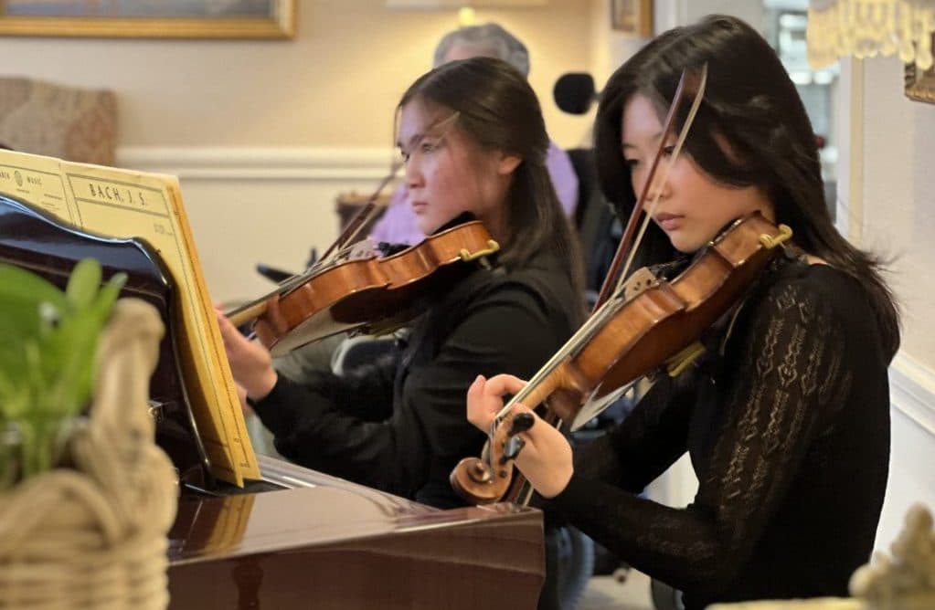 Residents enjoy a live student concert